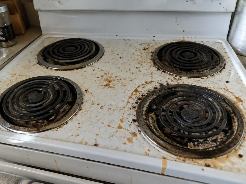 Greasy stove top before cleaning